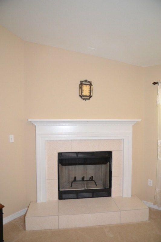 The corner wood fireplace in the Living Room photo 2370Barberee29CornerFireplace1024x768.jpg